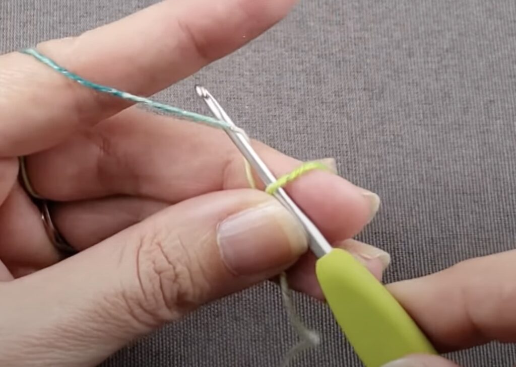 hands hold knitting needles and threads for knitting