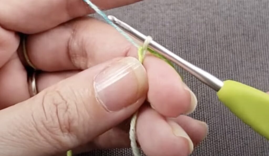 hands hold knitting needles and threads for knitting