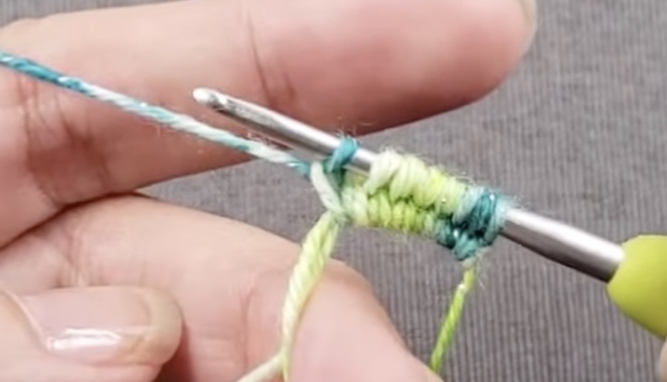 hands hold knitting needles and threads for knitting