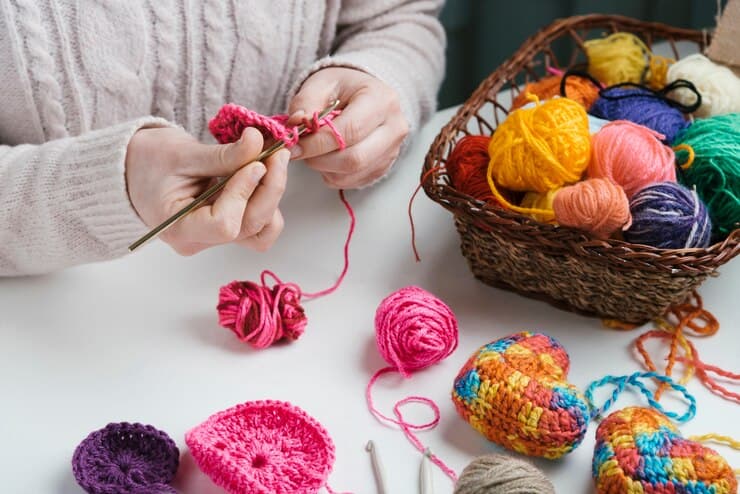 Woman Weaving and Basket of Wool Balls