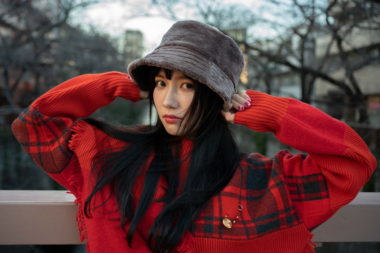 Woman posing with hat